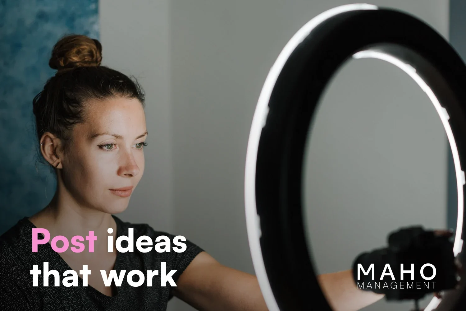 Creator next to a ring light and camera, setting up the next OnlyFans feed post